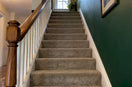 Carpeted staircase with neatly fitted stair edges